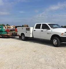 1e4fac7f91036095a633851c251754bc E.E.S. Inc. | company truck and trailer in a parking lot
