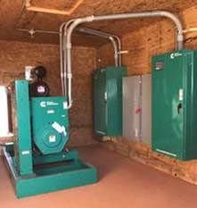 43ac9269856903a6b5d12415e3e1eb30 E.E.S. Inc. | large green Cummins generators in a room