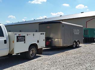 Ag-Generator-Installation-rect E.E.S. Inc. | company truck and trailer at business site